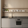 Widok minimalistycznej kuchni z jasną, metaliczną ścianą wykonaną z eleganckiej płyty węglowej do kuchni, tworzącej jednolitą i bardzo czystą powierzchnię.